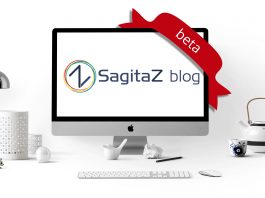 ordenador en una mesa de oficina blanco con la imagen del logo del blog de sagitaz