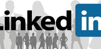 Logo de Linkedin sobre una imagen de siluetas de personal de negocios