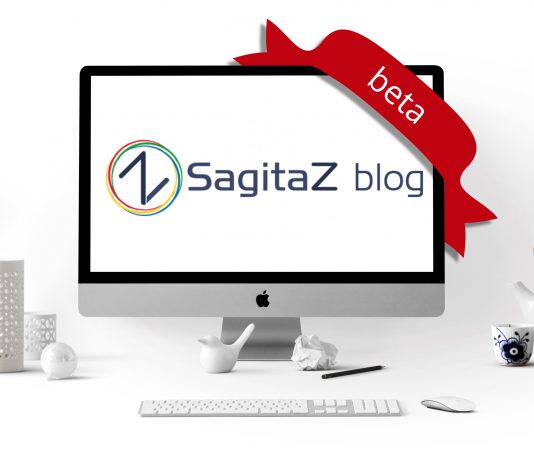 Блог SagitaZ 3.0 в beta версии ordenador en una mesa de oficina blanco con la imagen del logo del blog de sagitaz